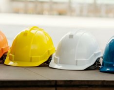 row of construction safety helmets
