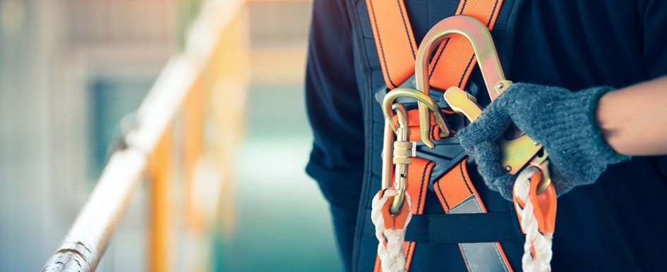 hand clipping safety harness in place