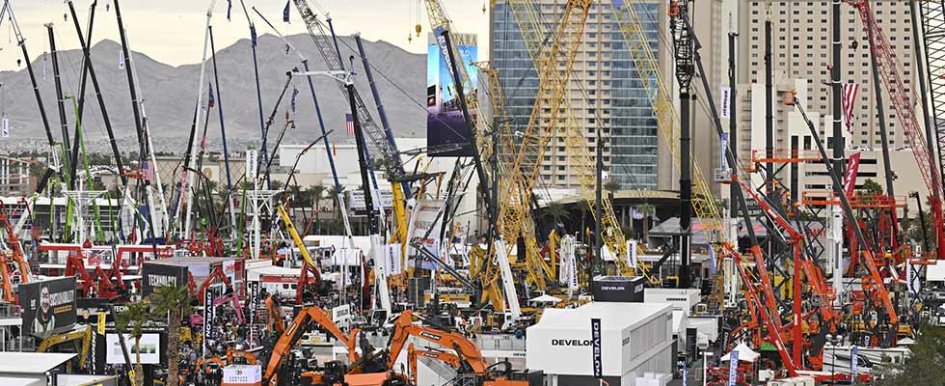 Conexpo 2023: Cranes in front of Las Vegas hotels, mountains in the background 