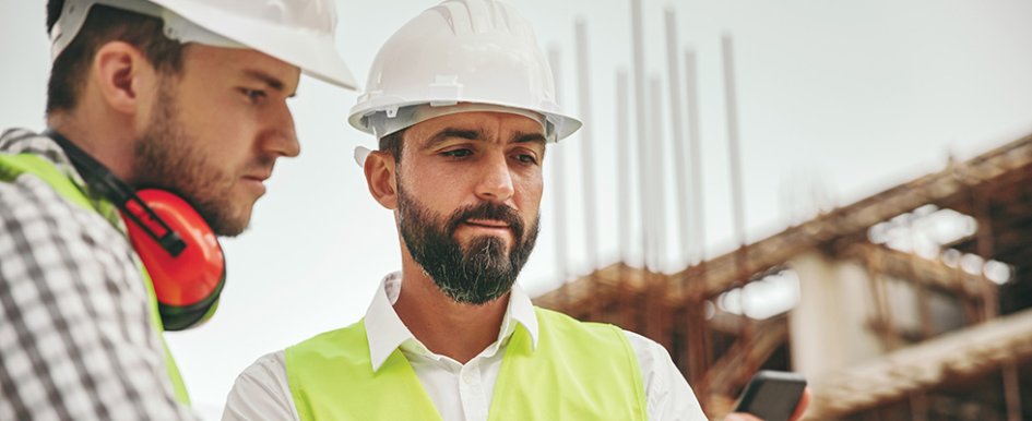 Two workers looking at something