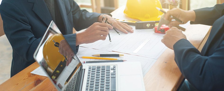 People working at desk/Adobe Stock
