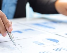 Hands doing paperwork/Adobe Stock