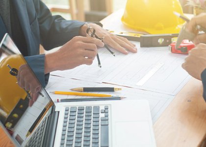 People working at desk/Adobe Stock