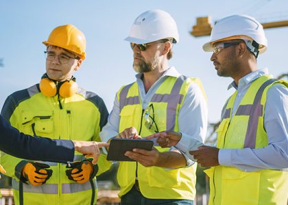 People in vests and hard hats/Adobe Stock